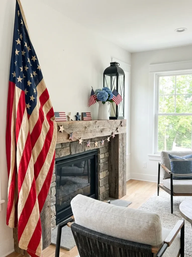 Asymmetrical patriotic mantel styling with a flag and a lantern.
