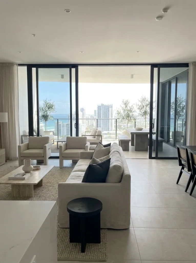 Seamless transition from interior living room to outdoor balcony – cohesive condo design