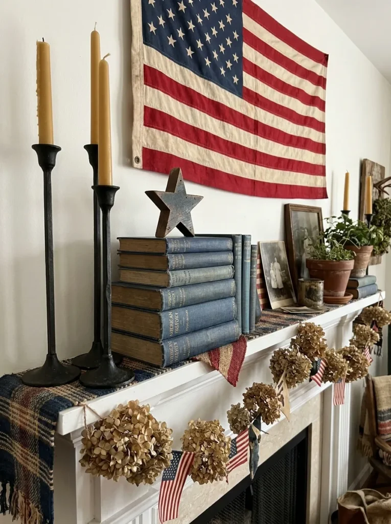 Layered patriotic decor showing varying heights with candlesticks and books.