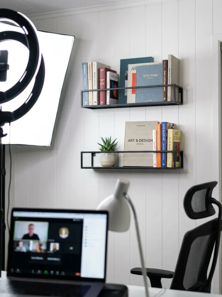 Curated office wall shelves for a professional video call background