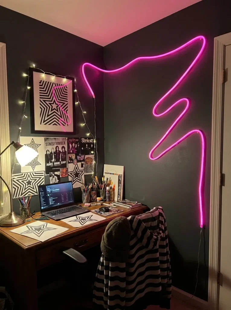 Glowing hot pink neon tube light framing a dark charcoal gray accent wall
