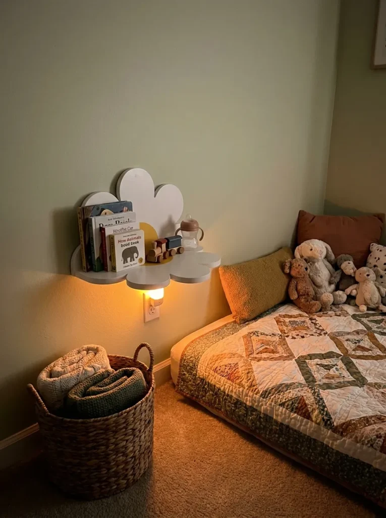 Small white daisy flower shaped floating wall shelf mounted low next to a bed