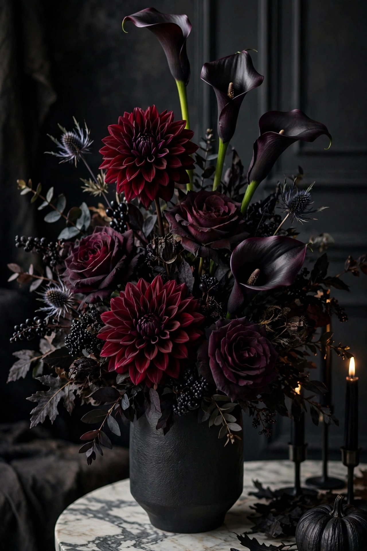 Burgundy dahlias and dark roses in a black vase as an elegant Halloween centerpiece